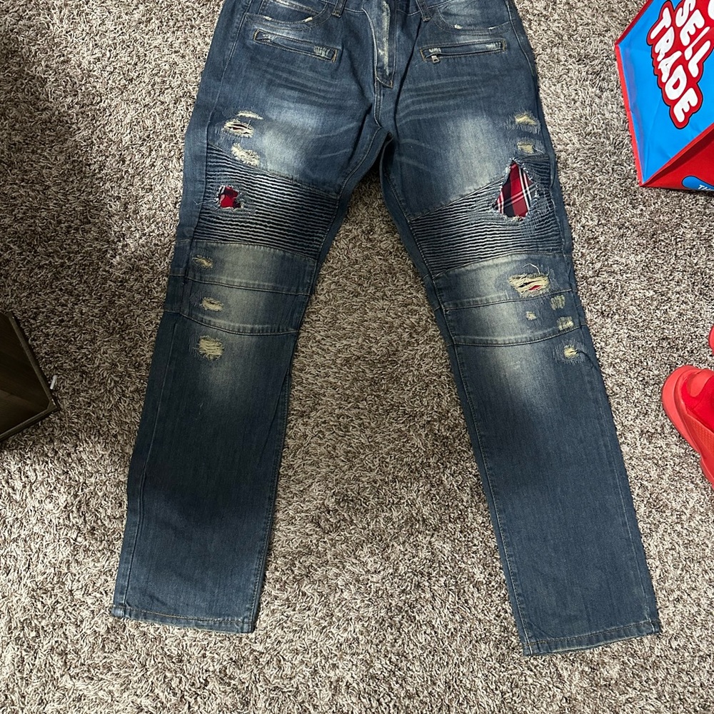 Distressed Denim Jeans with Red Accents